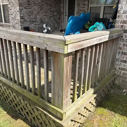 Weathered gray wood railing on a back deck before pressure washing — Hattiesburg, MS